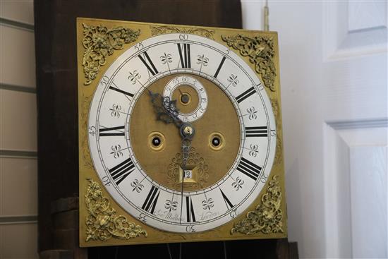 Sam Macham of London. A William and Mary mulberry cased eight-day longcase clock, 7ft. 2in. (plinth altered, parts replaced)